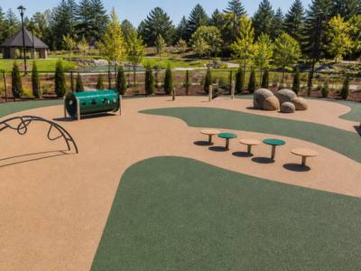 Dog park in tan and green rubber surfacing